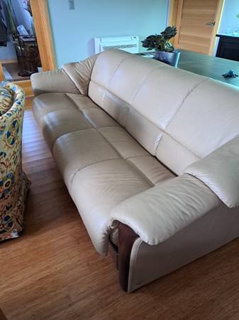 Leather couch, seats 4, elegant and comfortable