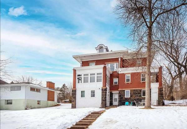 Individual bedrooms in large brick house