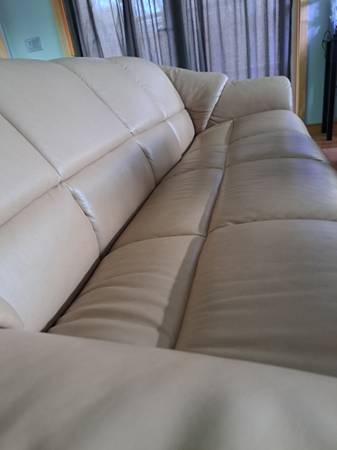 Leather couch, seats 4, elegant and comfortable