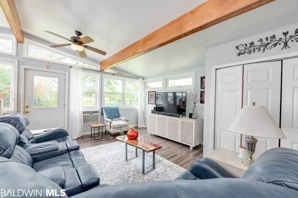 The living room has built in book cases and beautiful fireplace.