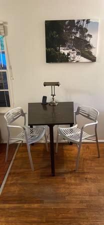 custom table by local woodmaker and aluminum chairs