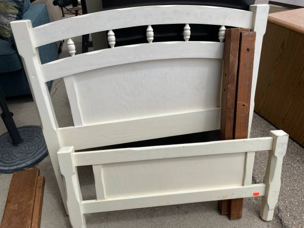 White wooden twin bed