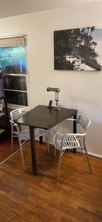 custom table by local woodmaker and aluminum chairs