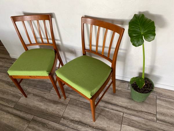 Danish modern solid sculpted back teak chair pair