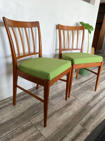 Danish modern solid sculpted back teak chair pair