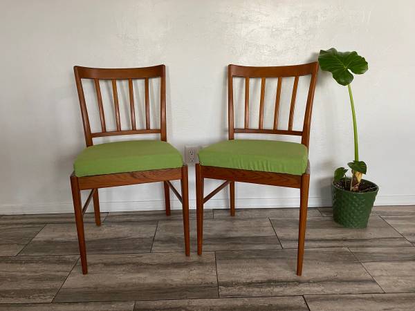 Danish modern solid sculpted back teak chair pair