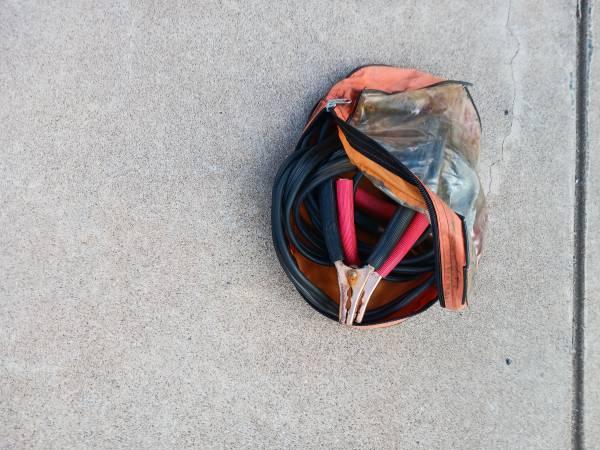 Set of automotive “jumper cables” in zipper case