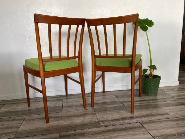 Danish modern solid sculpted back teak chair pair